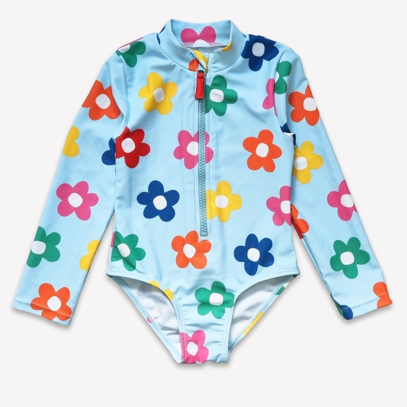 Children's swimsuit with colorful floral patterns on a light blue background