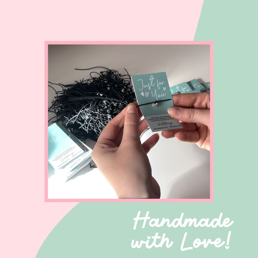 Hand holding a small box with 'Just for You' text against a pink and green gradient background.