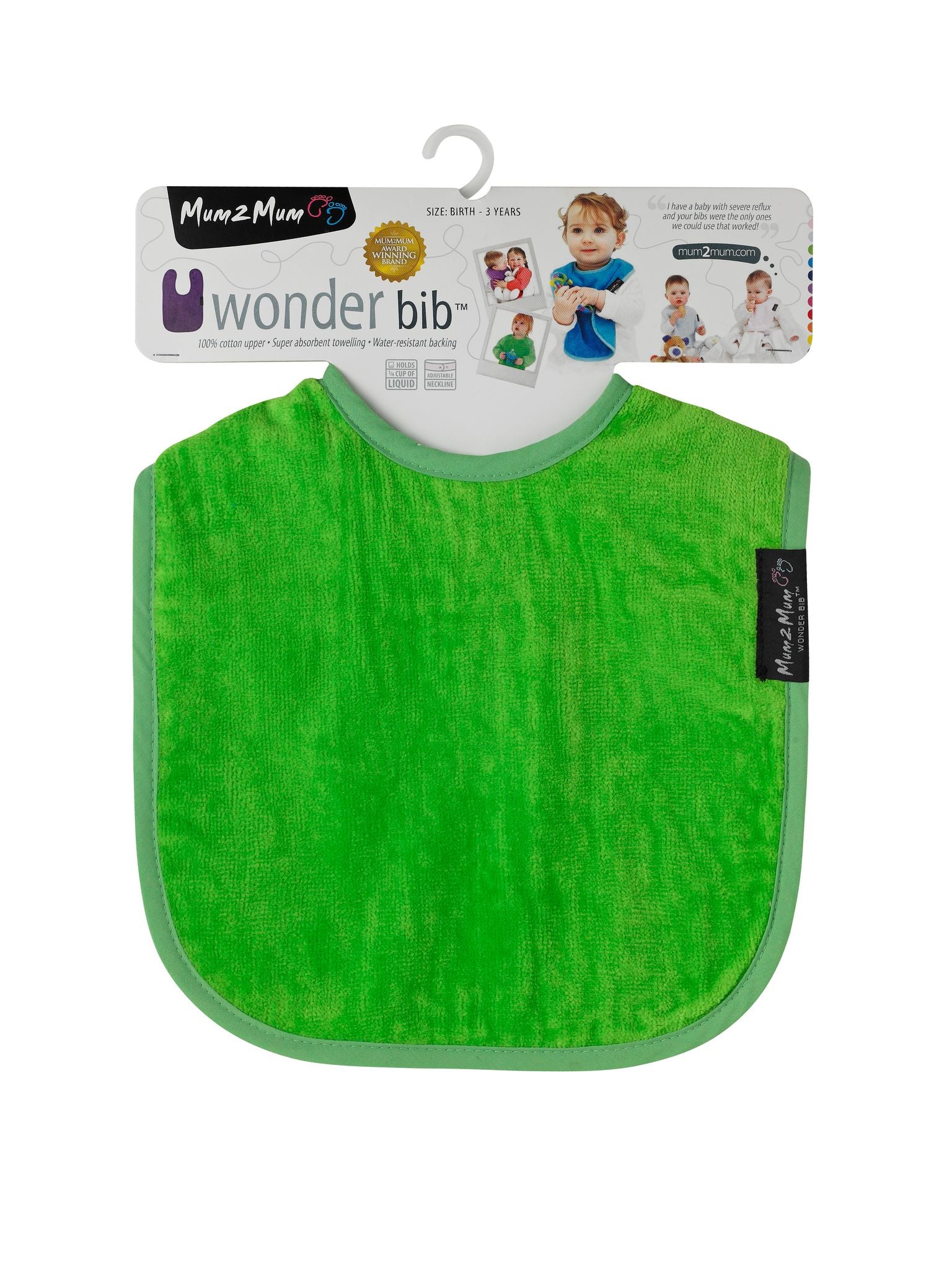 A bright green plush baby bib with a matching green trim, hanging from its original white cardboard hanger packaging. The packaging features the 'Momz Man' brand logo and product details.