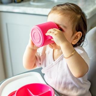 Learning Cup made from Silicone in Pink or Green - Baby&More